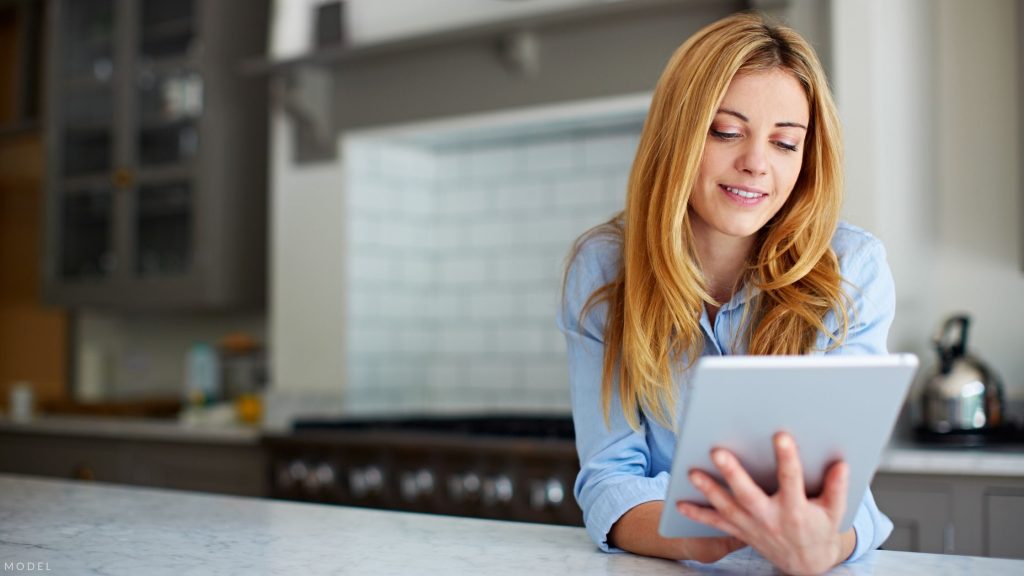 Woman researching CoolSculpting in Atlanta, GA.