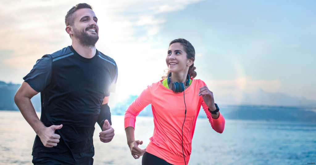 Woman and man jogging together