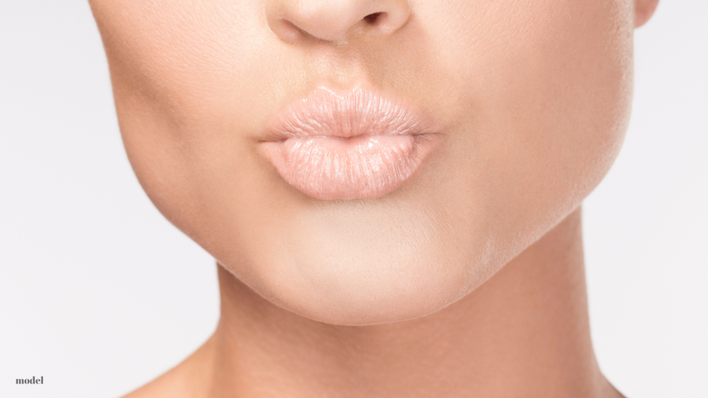 woman puckering her lips (model)