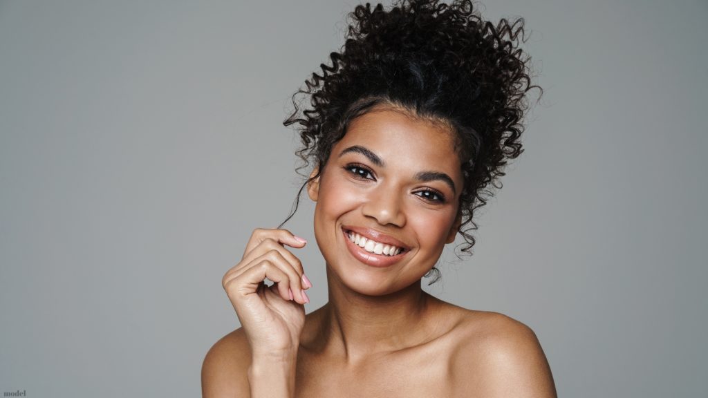 young smiling woman touching her hair (model)