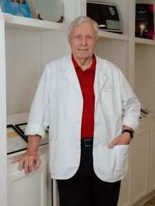 Dwayne Taylor, vein specialist at Buckhead Facial Plastic Surgery in a white lab coast.